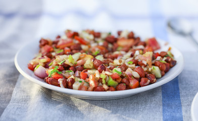 Homemade Spicy Vegetarian Gram Salad Also Know As Chana Salad or Chana Masala With Cutted Vegetables
