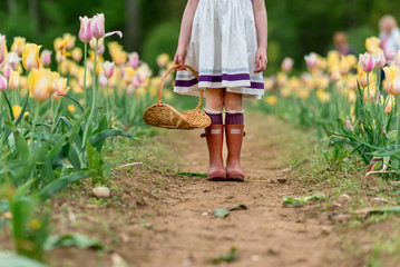Girl In Boots In A Garden