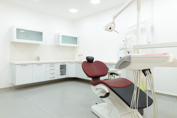 Interior of new modern dental clinic office room. Dentistry, stomatology,  medical equipment concept in dental cabinet