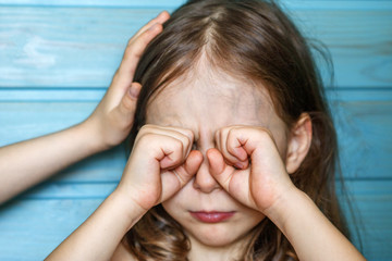 The girl calms her crying friend. Children's friendship, support