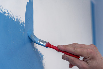 Brush with blue paint.