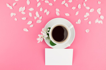 Flat lay of coffee, letter mockup and white petals