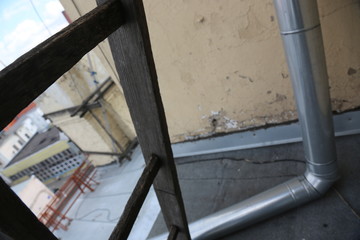 Moscow. Roof. Piece of pipe and stair