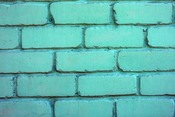 Background of brick painted green wall