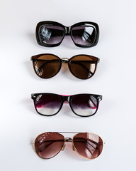 Collection of fashion elegance sunglasses on white background.