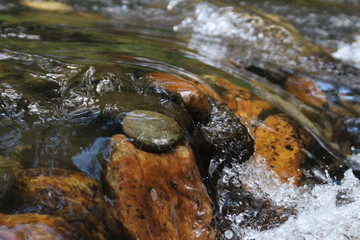 Water flowing over pebbles