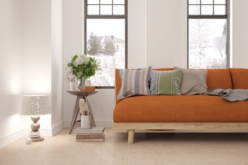 White room with sofa and winter landscape in window. Scandinavian interior design. 3D illustration