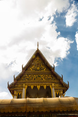 Fototapeta premium Roof with Cho Fa finials on Buddhist Temple with copy space