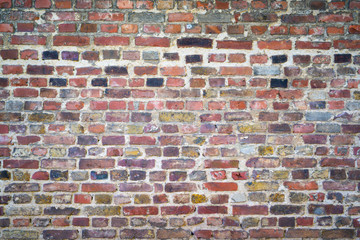 Old red brick wall as background or texture
