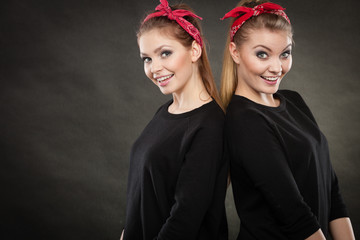Two funny positive retro styled female portrait.