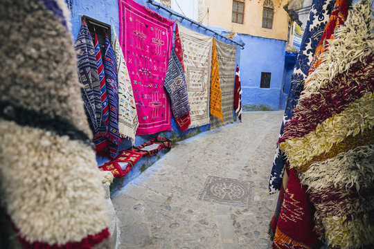 eastern carpets on the wall on street in old city in Morocco