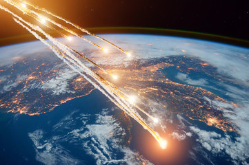 Falling burning flares of several meteorites of asteroids in the Earth's atmosphere. Elements of this image furnished by NASA. - obrazy, fototapety, plakaty