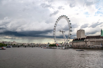 Fototapeta na wymiar View of the River Thames, the London Eye, and the Parliament in Westminster - London, United Kingdom