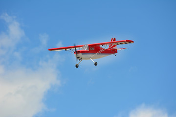 Homemade radio control aircraft on blue sky.