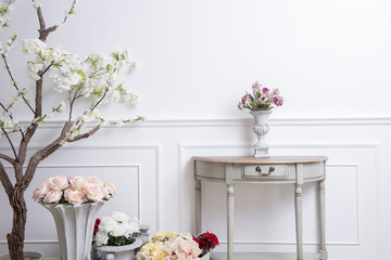 Elegant interior decoration with flowers on  white wedding background