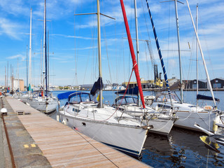  Yachts with lowered sails near the pier in the French city of Saint-Malo.