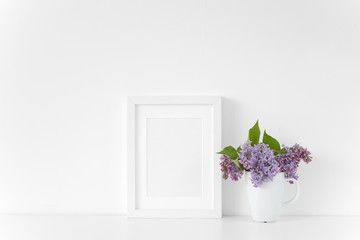 White frame with lilac bouquet on white background