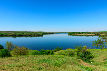 Naklejka na ściany i meble View at the estuary of the Kamenka River near the village of Respublikanets