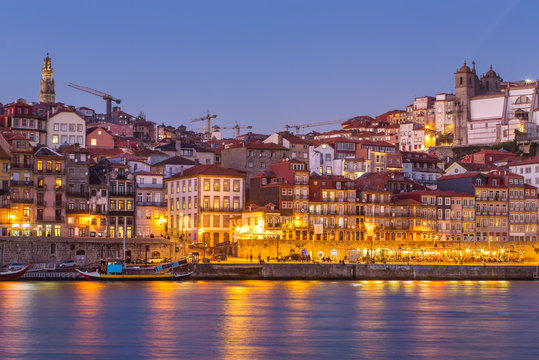 Porto old city skyline from across the Douro River at twilight, Portugal