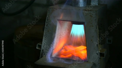 Heating Of Metal In A Gas Furnace Of A Blacksmith Stock Footage
