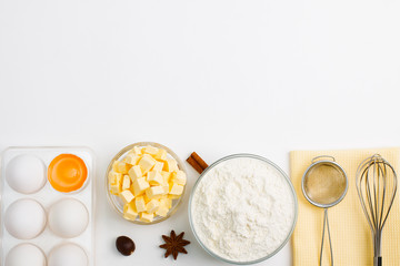 Fototapeta premium Cooking baking flat lay background with eggs butter kitchen tools