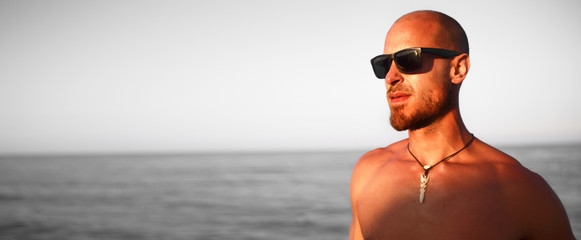 Close up of hot muscular man seaside