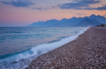 Konyaalti sand beach and Taurus mountains in the early morning light, Antalya, Turkey