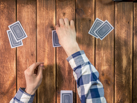 Overhead Top View Of Poker Dealer On The Wooden Table