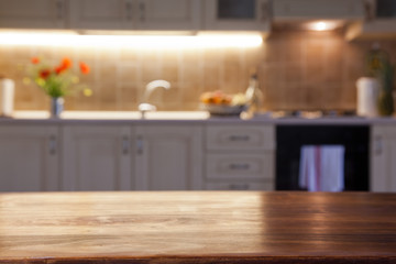blurred kitchen interior with wooden desk space