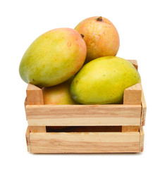 fresh mango fruit in a wooden box on a white background