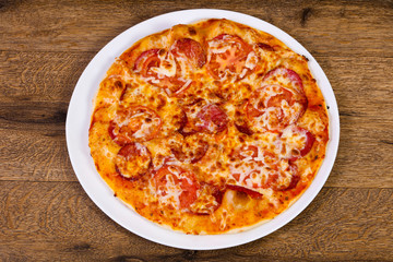 Pepperoni pizza with sausages