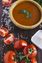 Tomato soup in a wooden bowl