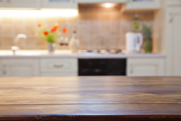 blurred kitchen interior with wooden desk space