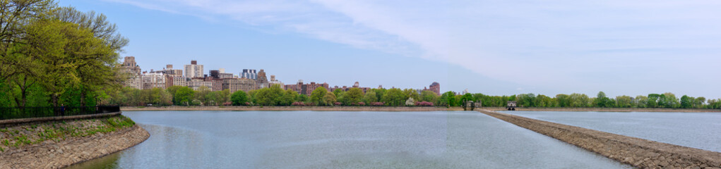 Central park reservoir with New York cityscape