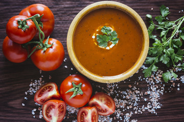 Tomato soup in a wooden bowl