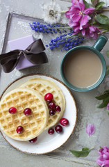 Art pink spring flowers frame on old wood background. Breakfast with coffee. Pink flowers isolated , floral frame. Decoration, bouquet.  