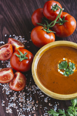 Tomato soup in a wooden bowl