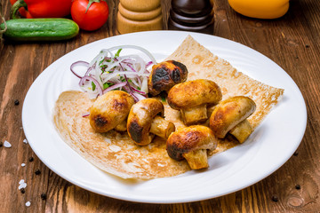 Skewers of mushrooms