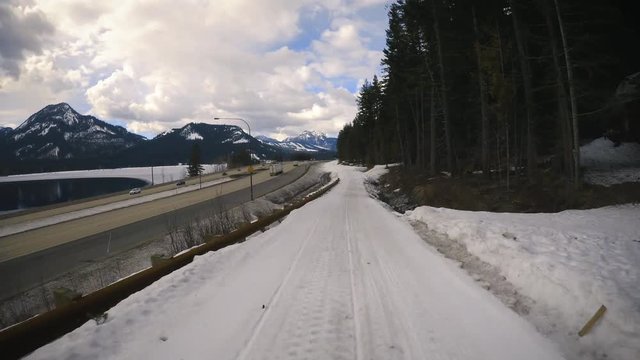 Snowmobile First Person View of Lake and Highway