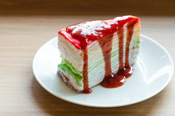 Delicious rainbow cake on plate