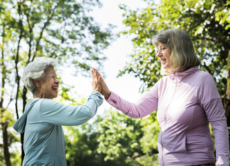 Senior friends exercising outdoors