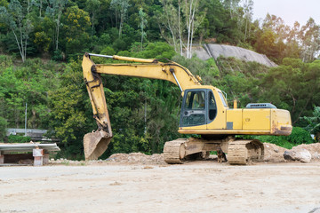 Heavy earth mover with blue sky in the background