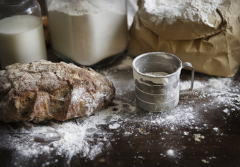 Flour and bread on a messy kitchen top