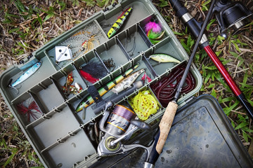 Aerial view of tackle box on the ground - obrazy, fototapety, plakaty