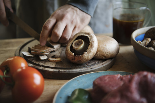 Closeup of slicing a mushroom food photography recipe idea