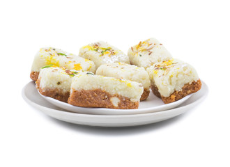 Indian Diwali Sweet Food Kalakand Also Know as Halwa or Mawa Kalakand is a Creamy Delicacy Made From Paneer or Cottage Cheese, The Dish Originated in Alwar, Rajasthan. Isolated on White Background
