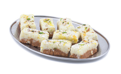 Indian Diwali Sweet Food Kalakand Also Know as Halwa or Mawa Kalakand is a Creamy Delicacy Made From Paneer or Cottage Cheese, The Dish Originated in Alwar, Rajasthan. Isolated on White Background