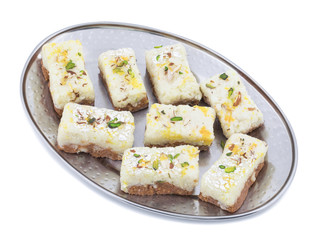 Indian Diwali Sweet Food Kalakand Also Know as Halwa or Mawa Kalakand is a Creamy Delicacy Made From Paneer or Cottage Cheese, The Dish Originated in Alwar, Rajasthan. Isolated on White Background
