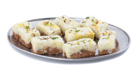 Indian Diwali Sweet Food Kalakand Also Know as Halwa or Mawa Kalakand is a Creamy Delicacy Made From Paneer or Cottage Cheese, The Dish Originated in Alwar, Rajasthan. Isolated on White Background