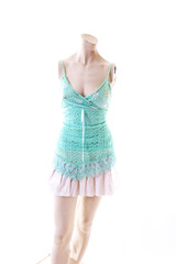 Blue top with mini skirt summer style on mannequin full body shop display. Woman fashion styles, clothes on white studio background.